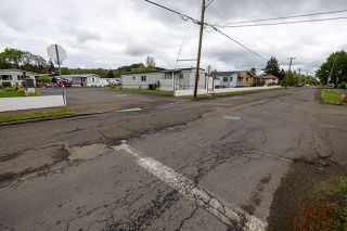 Rachel Thompson/News-Register##Sheridan resident Linda Harrell told the Sheridan City Council on April 20 that she has been concerned that on Saturdays the road becomes a &ldquo;speedway.&rdquo; The pavement has been patched several times, especially at the intersection of Southeast Clark, looking toward the Sheridan Senior Estates trailer park.