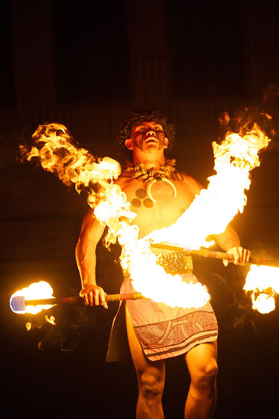 Rachel Thompson/News-Register##Mamalu Lilo of Honolulu-based Ma&lsquo;ohi Nui performs Siva Afi, or Samoan fire knife dancing, with a pair of flaming knives.
