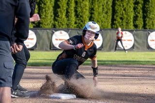 Nathan Ecker/News-Register##Tigers&rsquo; senior Addison Tuning slides into third base safely before popping right back up and sprinting home to complete her quasi-inside-the-park home run in Yamhill Carlton&rsquo;s 4-0 win over Santiam Christian on Friday, April 24. Tuning charged the ball into right field for a single and Eagle errors allowed her to round the bases. She went 2-for-2 on the day and reached a third time on a hit by pitch.