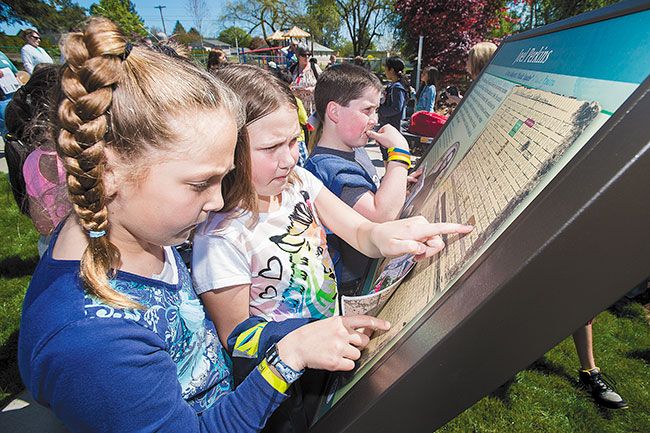 News-Register file photo##In 2015, Eva Branden, Adison Hansford and Keith Broden, then students at Wascher Elementary School, check out the new Joel Perkins memorial plaque after a dedication ceremony in Lafayette&rsquo;s Joel Perkins Park.