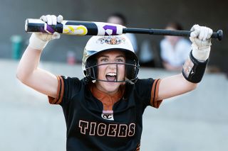 Rusty Rae/News-Register##YC-Dayton SB:
Tigers&rsquo; senior Josie Barker returns to her home dugout holding her bat like a trophy after driving in Yamhill Carlton&rsquo;s first run on a sacrifice bunt in the team&rsquo;s 4-0 win over Dayton at YCHS on Thursday, April 30. The score was the beginning of a three-run third inning for the Tigers.