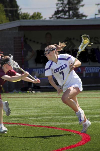 Photo courtesy of Amelia Solt##Senior Gabby Crist (7) charges past Willamette defenders before scoring a goal in the 4th quarter of Sunday&rsquo;s game.