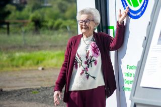 Emily Bonsant/News-Register##Former Gov. Barbara Roberts poses for a photo April 24 with an emblem of the planned Career Technical Education Center in Sheridan that will bear her name. Roberts, who served from 1991 to 1995 as Oregon&rsquo;s first woman governor, graduated from Sheridan High School in 1955.