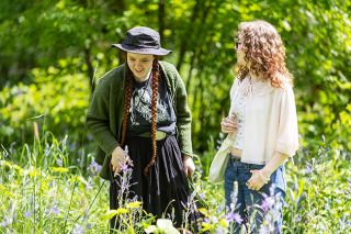 Rachel Thompson/News-Register##Freya and Hunter Kimbrough of Otis, walk among blooming camas near the Cozine Creek Friday during the Camas Festival on Friday, May 1, at Linfield University. Highlights of the festival included guided tours of the natural area, speakers, an Indigenous Creators&rsquo; Market, an art exhibit and children&rsquo;s activities.