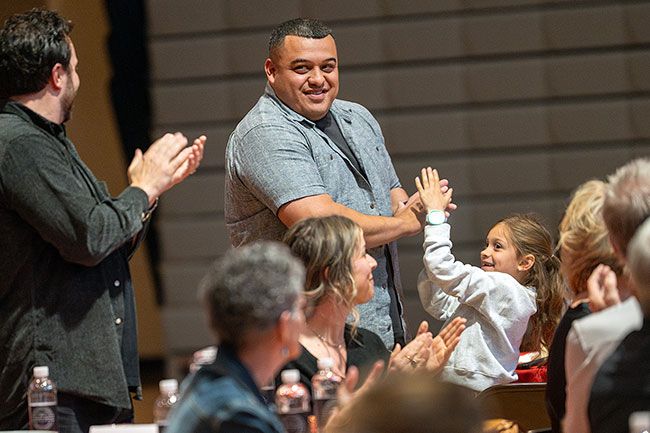 Rusty Rae/News-Register##Jonathan Flores is applauded as the Grizzlies  06 soccer team receives recogntion.