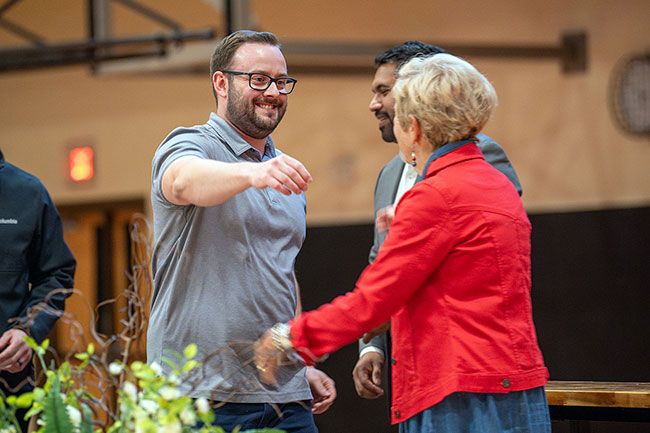 Rusty Rae/News-Register##Jeremy Weber, the Grizzlies&rsquo; title game MVP goalkeeper, goes to hug Ginny Crabtree. Weber had not returned to MHS since his graduation and could immediately feel how tight knit the team still was after 20 years apart.