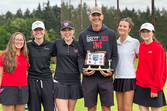 Photo courtesy of McMinnville Golf##From left to right: Isobel Rudolph, Mabel Findley, Maria Burke, Ben Heuberger, Amelia Duryee and Gabby Diamond pose with the Pacific Conference trophy after their title winning team match at Chehalem Glenn Golf Course on Tuesday, May 5. Three players hit personal bests to topple Sherwood and earn an automatic berth to the State Championship on May 18-19.