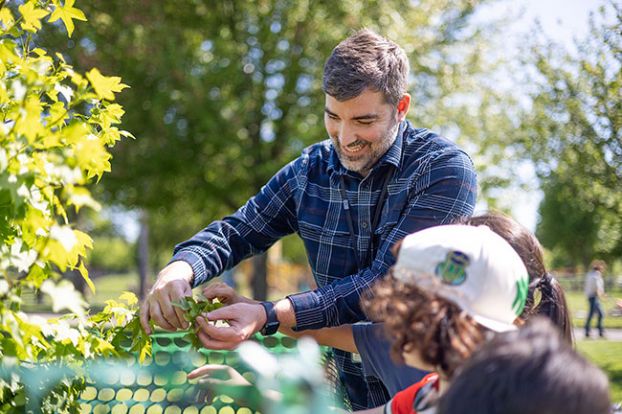 Rachel Thompson/News-Register##Brian Bixler spends time with students outside Willamette Elementary School, which in 2024 planted a Moon Tree that had flown into space on the Artemis I mission. Willamette is one of only a few schools in the nation to plant a Moon Tree seedling. Bixler, who is fascinated with the space program, applied for it on behalf of the school.