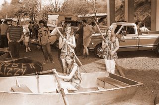 ## (May 8, 1971) The Skipperette Court was on hand last Sunday during the Yamhill River race, which drew a large crowd of spectators and entrants. Pictured are Chris Clary, left, Kathy Parker and Debbie Barnett (in boat). They presented trophies following race.