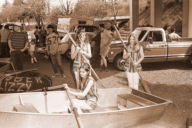 ## (May 8, 1971) The Skipperette Court was on hand last Sunday during the Yamhill River race, which drew a large crowd of spectators and entrants. Pictured are Chris Clary, left, Kathy Parker and Debbie Barnett (in boat). They presented trophies following race.