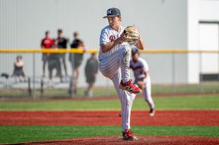 Rusty Rae/News-Register##Tyler Brummitt eyes into his catcher during his complete game versus Sherwood on Monday, May 11. As of May 14, the lefty leads the team in innings pitched (52.2), strikeouts (44) and ERA (1.46) while holding a 5-2 record.