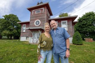Rachel Thompson/News-Register##Candace Morgan and Jake Wilson stand in front of the Bellevue Schoolhouse west of McMinnville. The couple purchased the vacant 1917 building earlier this year with plans to restore it into an event center and community gathering space.