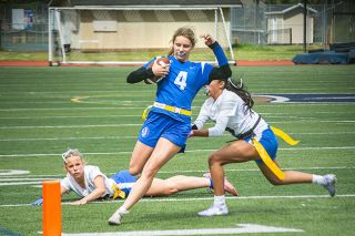 Emily Bonsant/News-Register##Amity senior quarterback Haley Miersma rushes against Gresham in the quarterfinals of the all classification flag football culminating championship at Liberty High School on Saturday, May 16. Miersma&rsquo;s flag was pulled at the two yard line. Amity was undefeated and ranked No. 1 until they fell to Tualatin in the semis and finished in fifth place.