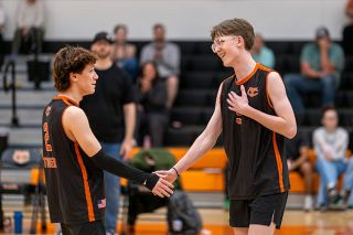 Rachel Thompson/News-Register file photo##Yamhill Carlton volleyball players Evan Rodriguez and Ethan Harris high-five after scoring a kill in the Tigers 3-0 win versus Faith Bible/Life Christian on April 30, in the Tiger Dome. The No. 12 Tigers advanced to the 4A/3A/2A/1A state playoffs and will travel to No. 5 Junction City at 5:30 p.m. on Wednesday.