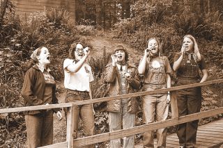 ##(May 21, 1976) It&rsquo;s always difficult to tell who has the most fun at Outdoor School sessions, the grade school students or the high school counselors. Pictured here, counselors living in the &ldquo;Belles of the Pool&rdquo; cabin practice a song which was to be sung at campfire. All seniors at MHS, they are (I to r) Gail Griffith, Erin Hartzell, Scotty Jahnke, Janet Hegna and Joan Crocker.