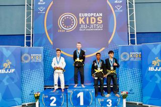 Photo courtesy of Brian Feucht##Ivan Kichera from Fight Sports International (2nd), Everett Feucht from Ronin Jiu Jitsu (1st) and Andr&eacute; Mateus Hins Caetano Rocha from CheckMat and Monovaiorahiti Itra imkmpeni from West Choke Family (3rd) stand atop their respective places on the podium at the 2026 European Kids IBJJF Jiu-Jitsu Championship.