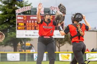 Nathan Ecker/News-Register##Ariel Glynn (left) and Ava Fleischman (right) get pumped up after Fleischman used her wits to pounce on a weak ground ball and throw out the final batter of Mac&rsquo;s 7-0 playoff victory over Sandy at Baker Field on Monday, May 25. Glynn closed out the game by throwing 29 of 41 pitches strikes, while Fleischman was a key offensive contributor with two RBIs and a triple.