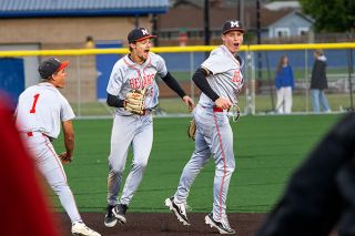 Nathan Ecker/News-Register##Mac seniors Tyler Brummitt (left) and AJ Morrison (right) celebrate their 3-2 victory over Beaverton in the first round of the 6A Baseball State Championship tournament on Monday, May 25 at Aloha High School. Brummitt was efficient on the mound and Morrison made a diving stop to record the final out.