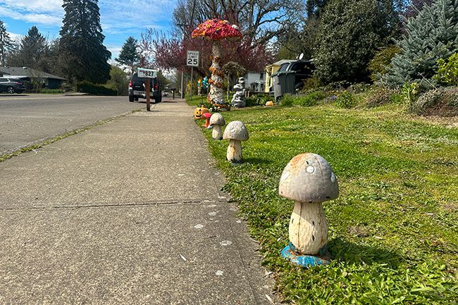 Kirby Neumann-Rea/News-Register##Eight-foot foam-formed mushroom has gained many new associates.