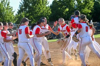 Rusty Rae/News-Register##The Grizzlies meet each other with high fives and tight embraces after recording the final out over Forest Grove. It was Mac&rsquo;s first win over the Vikings this season after two regular-season losses.