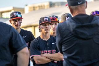 Nathan Ecker/News-Register##Seniors Cam Hyder, Aaron Rolfe and AJ Morrison soak in their loss to West Linn while listening to their coaches speak for the final time in a Grizzly uniform.