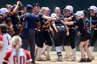 Photo courtesy of Kelly Bird, Linfield Athletics##The Wildcats crowd around home plate, jumping onto Cydney Hess as she stomps on the plate after her game tying home run in the seventh inning versus Simpson College on Saturday, May 30. Over her final three games as a Wildcat, Hess went 6-for-11 with three runs scored and seven RBIs.