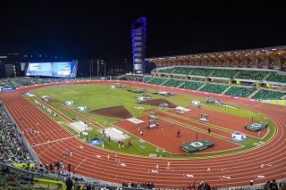 Nathan Ecker/News-Register##Nearing midnight on Friday, May 29, athletes on the track at Hayward Field prepare a heat of the 4x400-relay event. With the crowd thinned, the only ones who remained were those with passions to share for their team, which makes these late hours in Eugene some of the most special for Class 1A, 2A and 3A athletes.