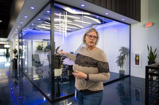 Rachel Thompson/News-Register##Sheyla Wulf-Howell shows off EMPWR&rsquo;s new offices in McMinnville, which are in a 100,000 square foot building just opened next to its existing quarters on Booth Bend Road. The two-story building includes offices, conference rooms and employee gathering areas, and a break room overlooks one of the production lines where the company makes protein bars.