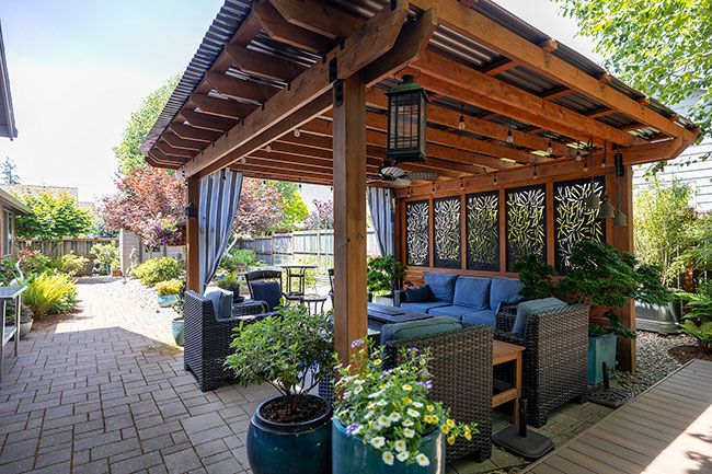 Rachel Thompson/News-Register##Gates said they fixed up the covered area as a place for guests. They love hosting parties in their garden.