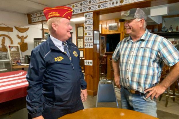 Starla Pointer/News-Register##National American Legion Commander Dan Wiley talks with Scott Bernards, a member of Carlton Memorial Post 173 and the post&rsquo;s firefighter of the year. The national commander visited Carlton and other Yamhill County posts, praising them for their programs for members and the community, including Carlton&rsquo;s annual honors for firefighters and police officers.