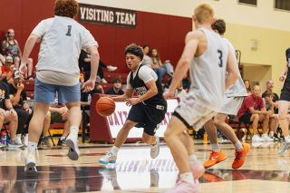Nathan Ecker/News-Register##John Corona drives to the paint in Dayton&rsquo;s summer bout versus YC at the Pirate gymnasium on Thursday, June 11.