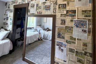 Submitted by Adie and Eliza Nisly##News-Register coverage of the athletic achievements of the Nisly twins, Eliza and Adie, decorate a wall in their home in Amity. The star duo helped lead the Amity High Warriors to state titles in basketball and soccer, in addition to highlights in track and field, during their just-concluded four year tour.