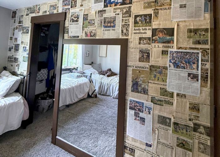 Submitted by Adie and Eliza Nisly##News-Register coverage of the athletic achievements of the Nisly twins, Eliza and Adie, decorate a wall in their home in Amity. The star duo helped lead the Amity High Warriors to state titles in basketball and soccer, in addition to highlights in track and field, during their just-concluded four year tour.