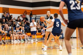 Nathan Ecker/News-Register##Incoming Tiger freshman Kenley Sticka looks for an open pass past Banks&rsquo; senior Kylie McCraw during YC&rsquo;s summer league contest versus the Braves on Thursday, June 18, in the Tiger Dome. Sticka served as the Tigers&rsquo; point guard and showed high-quality ball control skills as YC played its fourth of five games on the day.