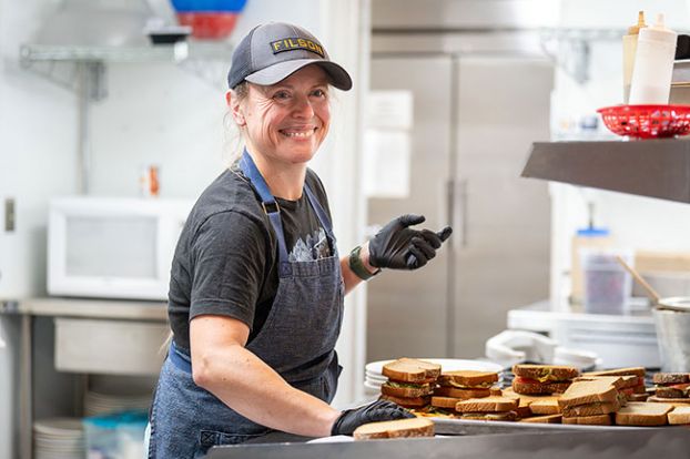 Rusty Rae/News-Register##Soup Kitchen at St. Barnabas chef and manager Jessica Callahan prepares hearty sandwiches for Monday&rsquo;s dinner service at the nonprofit dining spot, which provides free food to anyone in need from 4 to 6 p.m. weekdays. Callahan said she finds it rewarding to be able to help people by feeding them.