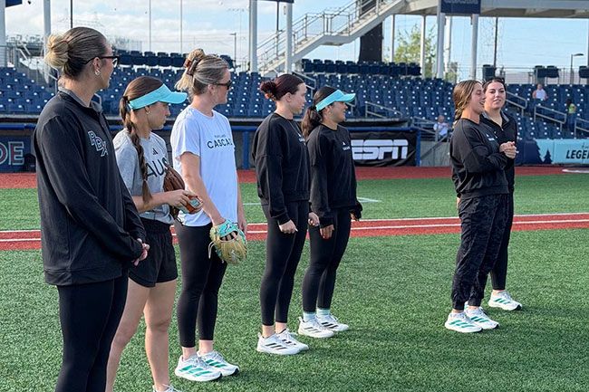 Photo courtesy of Josh Terry##Members of the AUSL Portland Cascade speak to youth players during a camp that took place between high school and professional games.