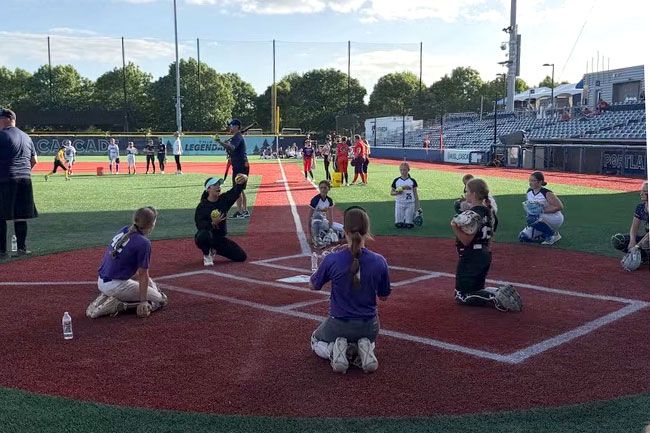 Photo courtesy of Josh Terry##Cascade catcher Mia Davidson instructs youth players on the proper ways of how to receive a pitch.