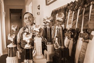 ##(June 25, 1976) Pat Paola of Carlton has quite a collection of trophies won between 1949 and 1953 from the annual Pacific Coast Turkey Exhibit. Pat&rsquo;s wife Grace actually started their turkey operation with one hen and a setting of eggs in 1937. They made $60 that first year and continued expanding the operation, reaching a  maximum of 5,000 birds, until 1961. &ldquo;In those days,&rdquo; says Grace, &ldquo;We had to pluck them ourselves.&rdquo; The Pacific Coast Turkey Exhibit was the forerunner of Turkey Rama.