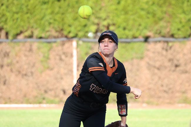 Nathan Ecker/News-Register file photo##YC&rsquo;s Ella Amerson makes a throw to first base in the Tigers&rsquo; 4-0 win over Santiam Christian on April 24.