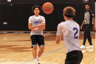 Nathan Ecker/News-Register##Incoming Amity sophomore Carter Haarsma makes a pass to Austin Lopez in their summer league game versus Taft at the Warrior gymnasium on Tuesday, June 20. Haarsma was the Warriors&rsquo; top guard in his freshman season. He saw a plethora of double teams and heavy on-ball pressure, but is using a combination of experience and less-stressful summer situations to figure out how to more effectively distribute and open opportunities for himself.