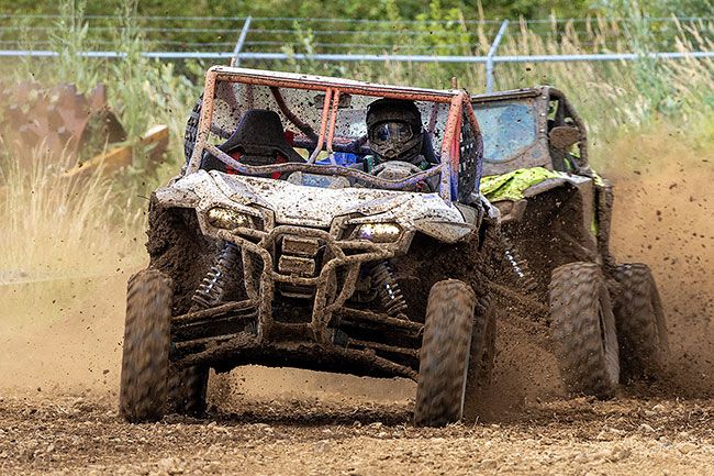 Nathan Ecker/News-Register##Steven Brown of Sheridan in a red, white and blue 2021 Honda Talon keeps his lead over Brad Himes of Tillamook around the final turn of Willamina&rsquo;s side-by-side short course race on Saturday, June 27. Brown was the best of the factory side-by-side class, becoming the first No. 1 winner in what was the Willamina Mud Drags maiden voyage into side-by-side racing.
