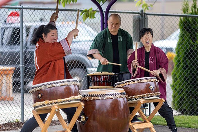 Rachel Thompson/News-Register##Michelle Fujii, left, Toru Watanabe and ManMan Mui of Unit Souzou perform on taiko drums ranging from small, high-pitched varieties to large, booming ones. Fujii compared the ensemble to an orchestra, explaining that each drum has its own voice, function and pitch.