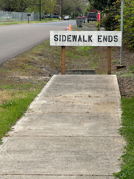 Kirby Neumann-Rea/News-Register##Shel Silverstein would love the pair of signs on Ash Street in Dayton.