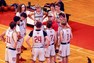 Nathan Ecker/News-Register##McMinnville Head Coach Tucker Coil instructs his players during a timeout in one of the Bears summer league contests inside the Mac gymnasium. Every huddle has been a moment of growth for Coil and his team, who are looking to make stronger connections on and off the floor heading into a season after graduating eight seniors that Coil coached from their time as freshman.