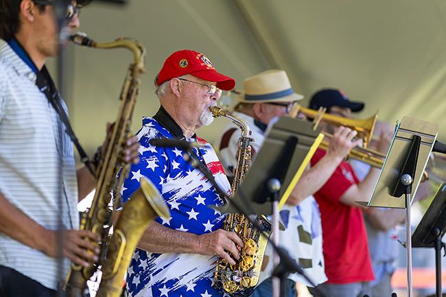 Rachel Thompson/News-Register##Ron Bork performs with Second Time Refined during the Saturday in the Park celebration at the fairgrounds.