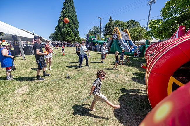 Rachel Thompson/News-Register##Children and adults enjoy carnival games during Saturday in the Park &ndash; America 250 at the Yamhill County Fairgrounds. The inaugural event included live music, historical reenactors portraying Thomas Jefferson and Abraham Lincoln, food vendors and family activities throughout the day.