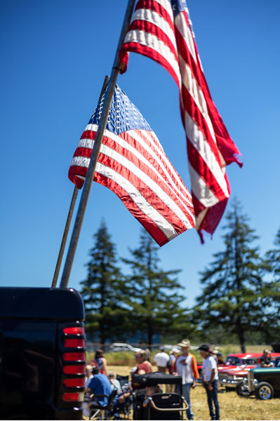 Rachel Thompson/News-Register##American flags are displayed from the bed of a Ford pickup at the Fourth of July car show in Willamina.