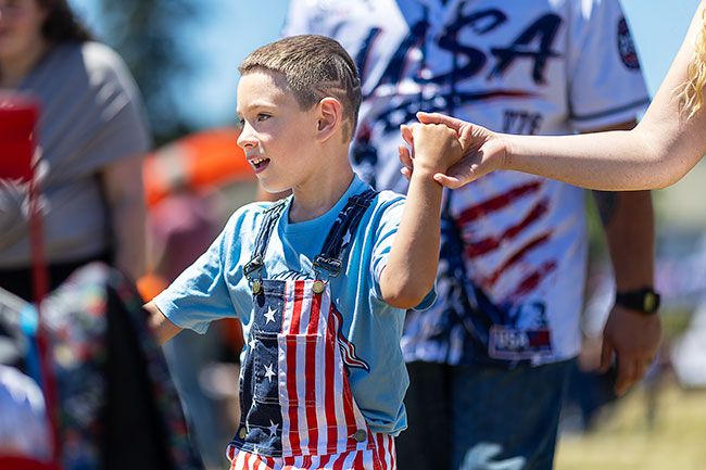Rachel Thompson/News-Register##Trenten Perry, 6, of Sheridan holds his mother Katie&rsquo;s hand as they arrive at the Willamina car show