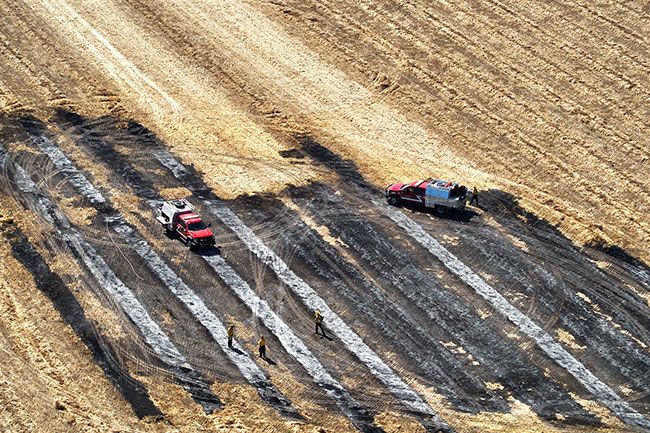 Image: Yamhill Fire Protection District##On Monday, July 6, Yamhill Fire and other regional agencies doused 1.5 acres of cut clover that caught fire from a combine.