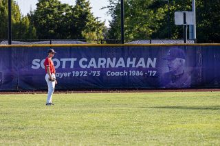 Nathan Ecker/News-Register##Incoming McMinnville senior Taylor Carnahan and former Linfield player, coach and athletic director Scott Carnahan meet in the outfield at Roy Helser Field during the Grizzlies&rsquo; summer ball contest versus Columbia River on Saturday, July 11. Carnahan&rsquo;s grandson played all over the diamond, most prominently featured in right and center field, while Mac played a trio of their Premier Wood Bat Tournament games at Scott&rsquo;s old stomping grounds.